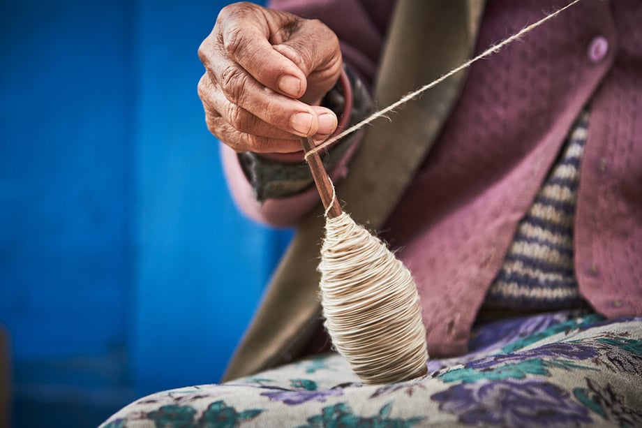 Mark Katzman’s Real and Raw Travels through India for FES - Woman making yarn for clothing. 