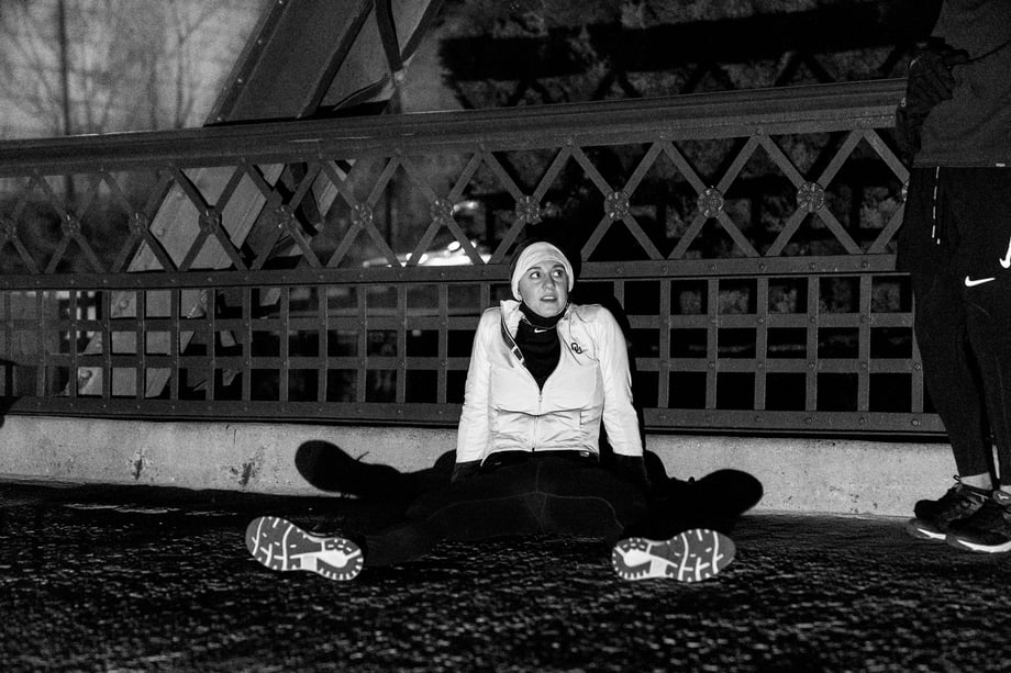 Matt Trappe photographs exhausted runner at the end sprawled out on the pavement for Take the Bridge in Denver