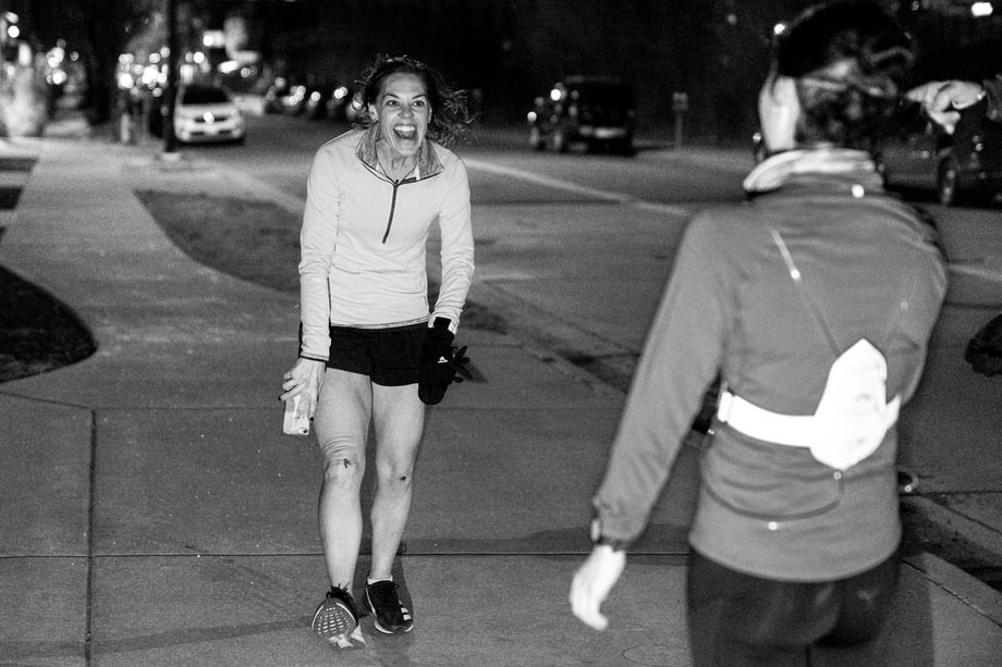 Matt Trappe photographs runner finished happy to see her friends with skinned knees and big grins for TTB in Denver