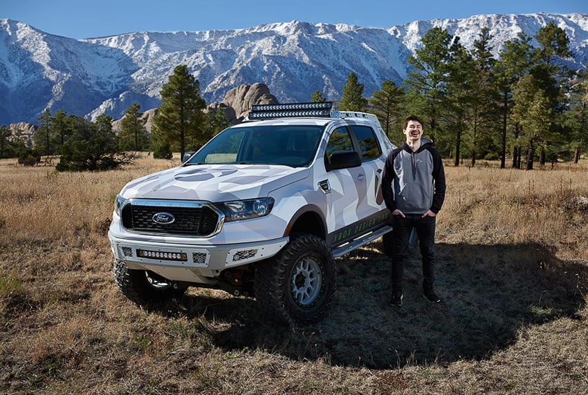 Nick Andrew standing beside Ford truck