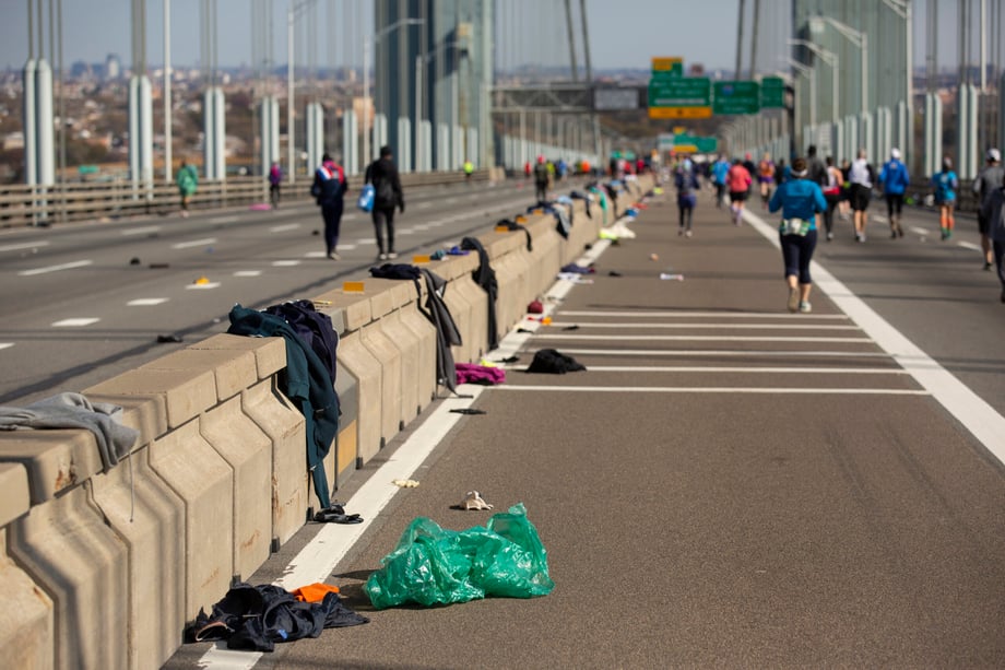 Ben Norman shows the marathon's aftermath of discarded running clothes on the Verrazano Bridge