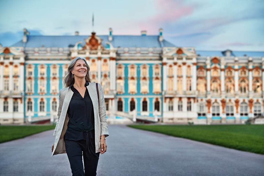 A woman walks in front of Katherine's Palace in St. Petersburg, Russia in this collaborative shot
