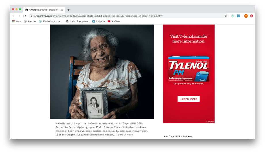 Screenshot of The Oregonian showing 105 year old Isabel holding a photo of herself as a young girl