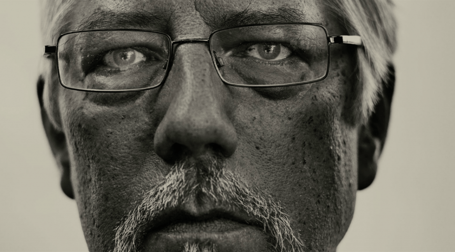 Close-up of a man with glasses shot by Detroit-based automotive photographer Roy Ritchie