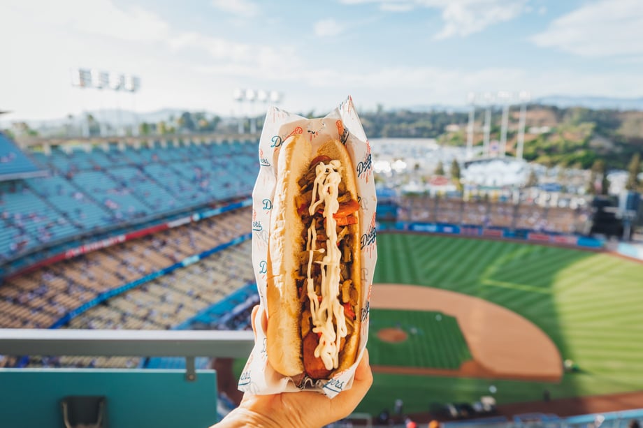 Similar to the earlier shot, this photo by Krystal Thompson shows a hot dog being held up with the stadium behind it.