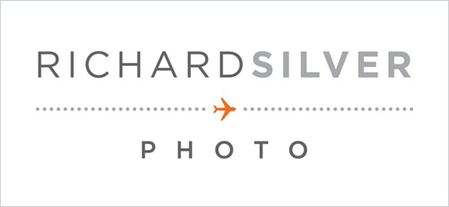 The final logo with dark grey and light grey text separated by the visual of an orange airplane on a dotted line