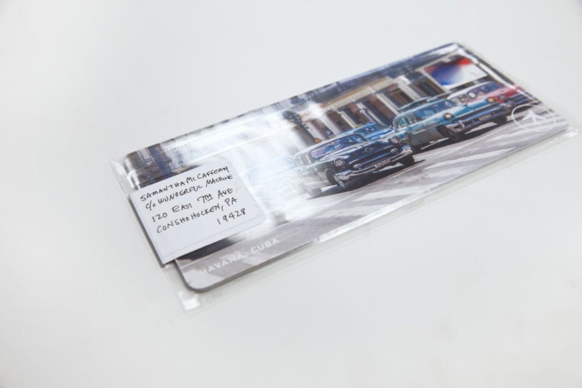 promo delivery look from the front showing an image of cars in Havana Cuba