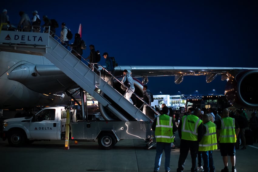 Seattle Seahawks board plane en route to London, photographed by Brett Carlsen for the New York Times