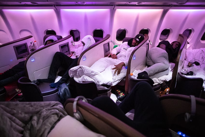 Seattle Seahawks sleeping in airplane pods, photographed by Brett Carlsen for the New York Times
