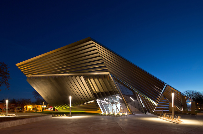 Exterior of the Eli and Edythe Broad Art Museum at night, with surrounding lights shining, shot by Columbus, Ohio-based Brad Feinknopf