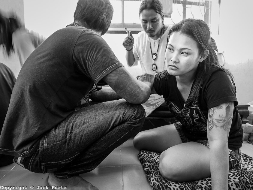 A woman receiving a spiritual tattoo, photograph by Jack Kurtz
