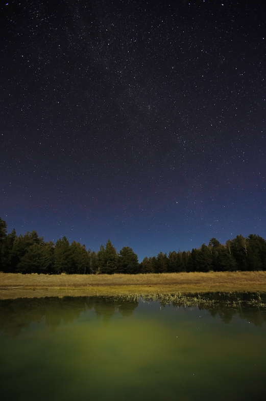 The lake under a starry sky photographed by John Burcham
