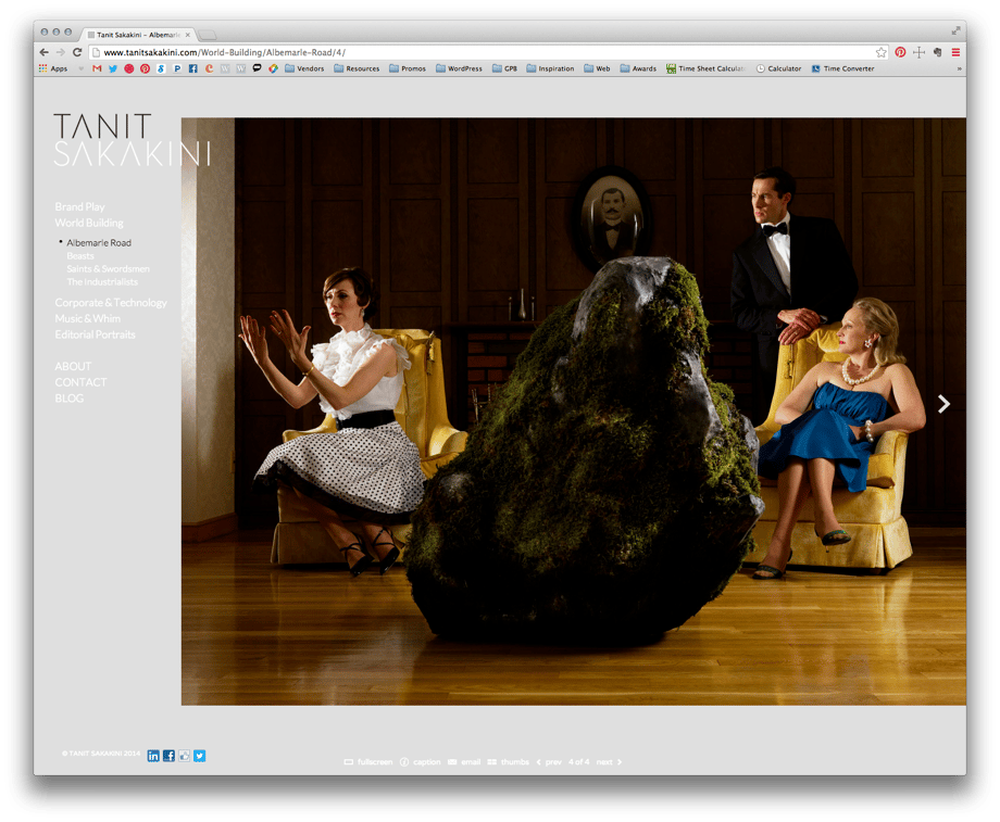 Tanit Sakakini's gallery showing a photo of a people in a fancy room with a giant, moss covered rock in the middle.