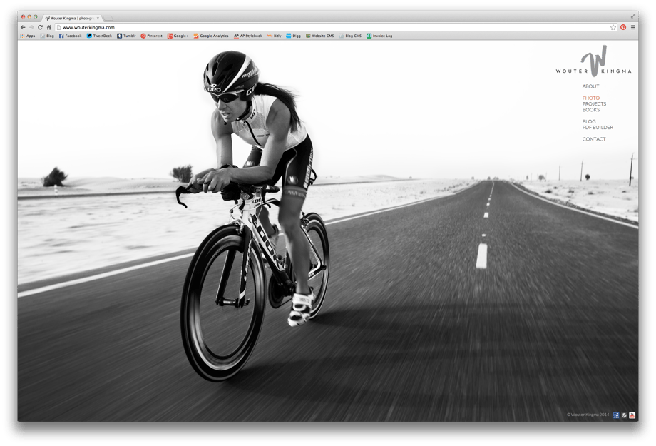 Screenshot image of Wouter Kingma's website after the web edit showing a cyclist speeding down an open road.