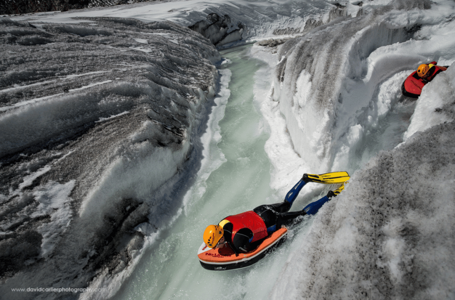 Switzerland-based adventure photographer David Carlier climbed Europe's largest glacier to photograph adventurers Claude-Alain Gailland and Gilles Janin hydrospeed down a glacial river stream on a raft.