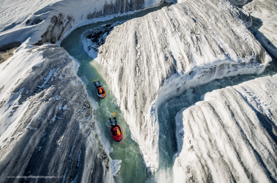 Switzerland-based adventure photographer David Carlier climbed Europe's largest glacier to photograph adventurers Claude-Alain Gailland and Gilles Janin hydrospeed down a glacial river stream on a raft.