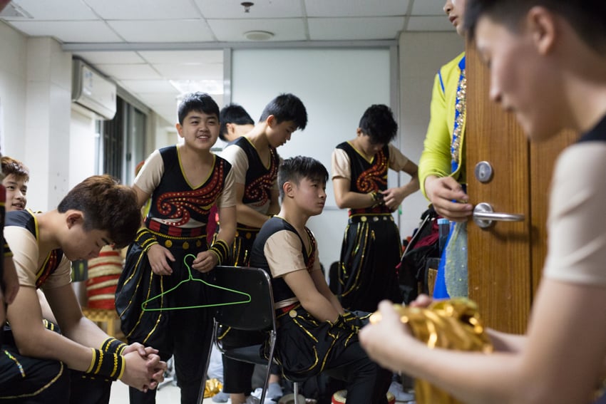 Young Chinese Acrobats getting in costume by Jonathan Browning