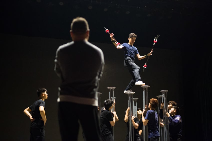 Chinese Tai'an Acrobats learning a new act by Jonathan Browning