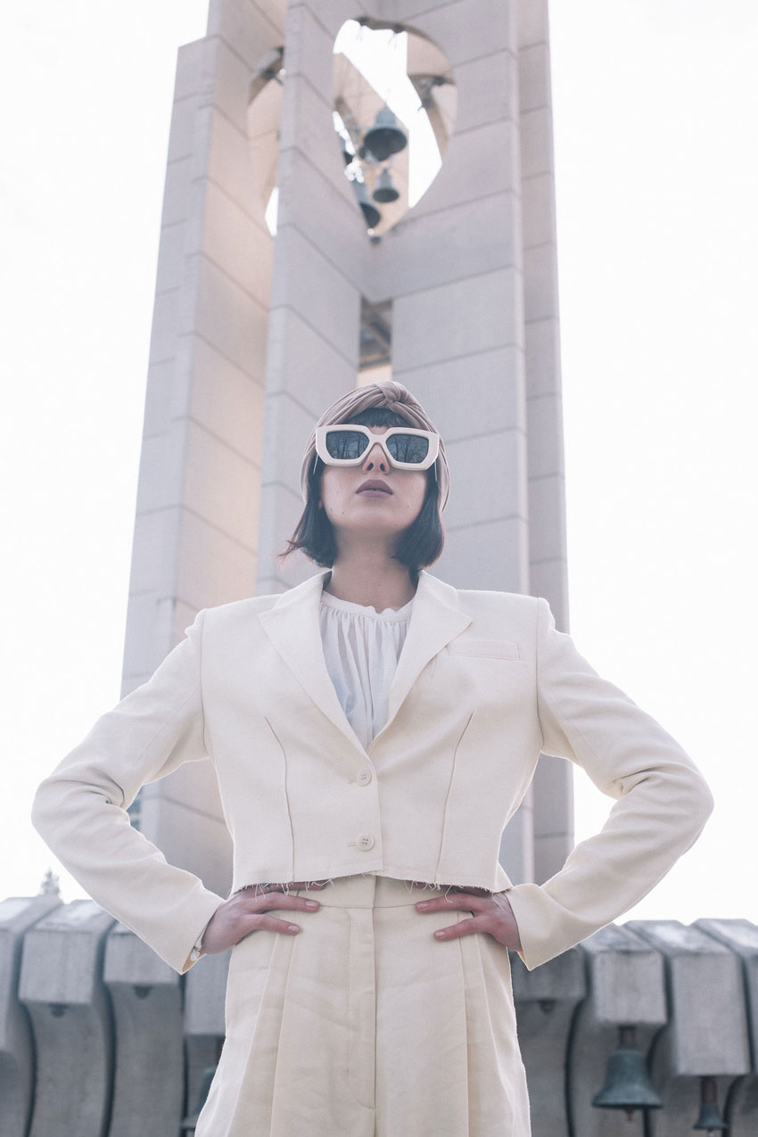 Tina Boyadjieva Bulgaria Fashion shoot looking upward at Victoria in front of the Children's monument for peace