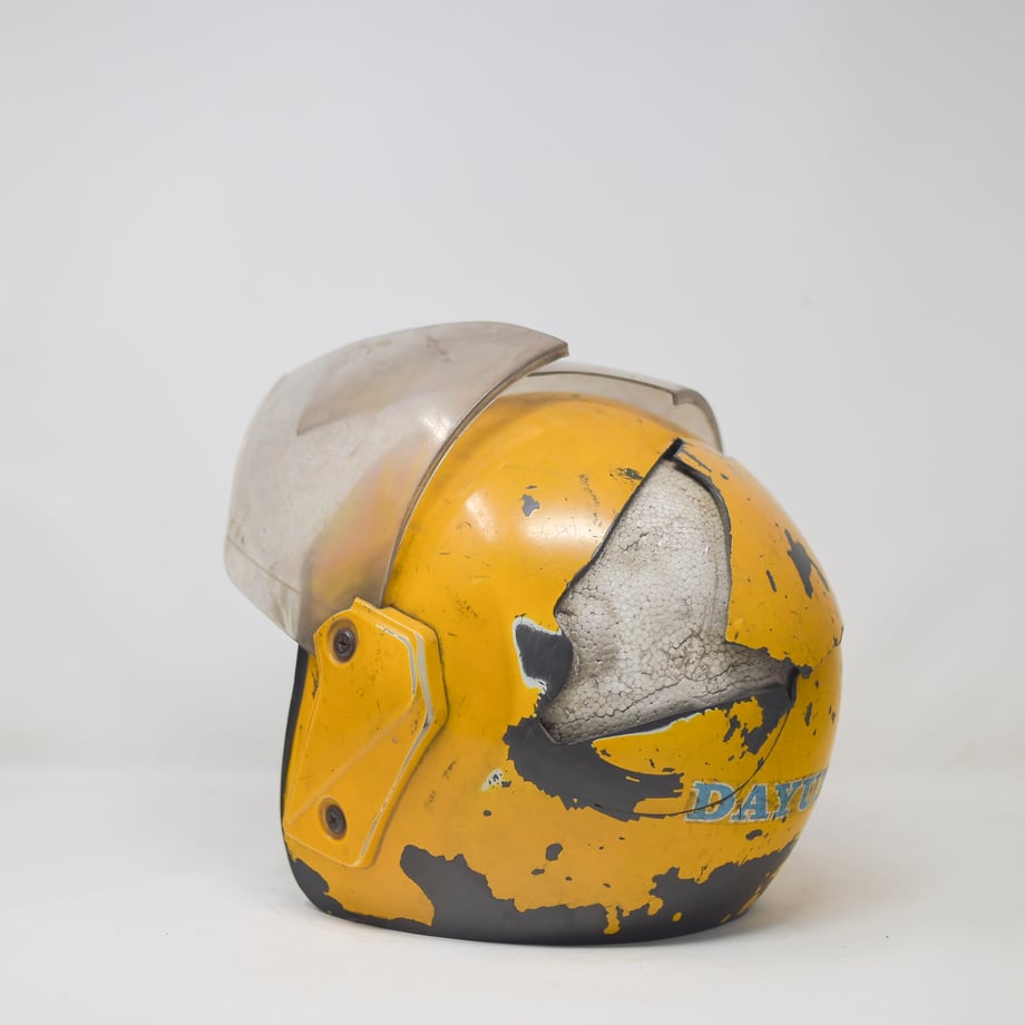 Tobin Jones' shot of a well-worn helmet with a large chunk broken out of the rear exterior 