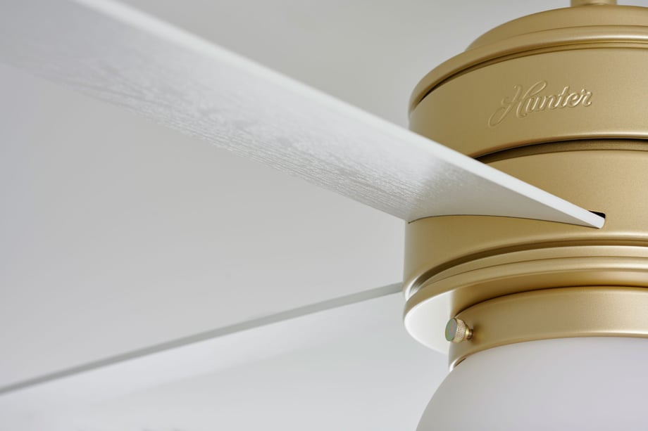 William DeShazer captures every grain of wood on white and gold fan for Hunter Fan Company