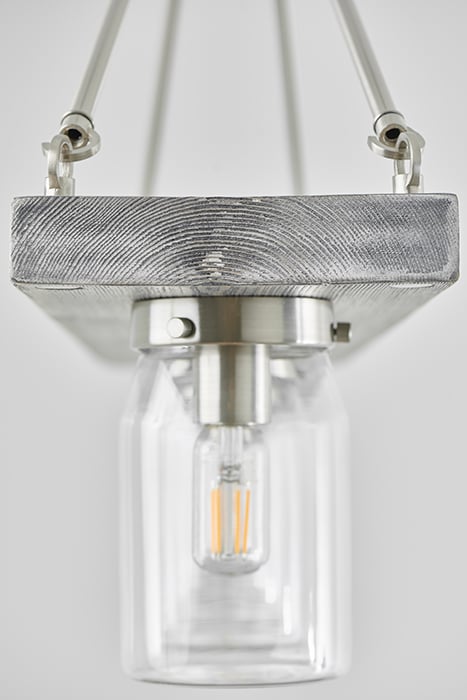 William DeShazer photographs silver light fixture for Hunter Fan Company