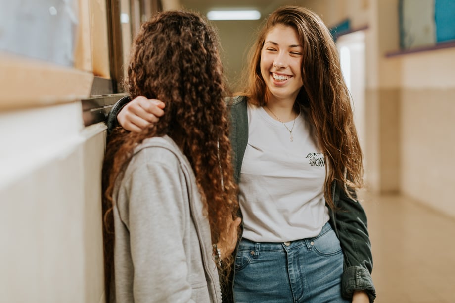 Ronen Goldman snaps a shot of two teen students, standing in a hallway and laughing