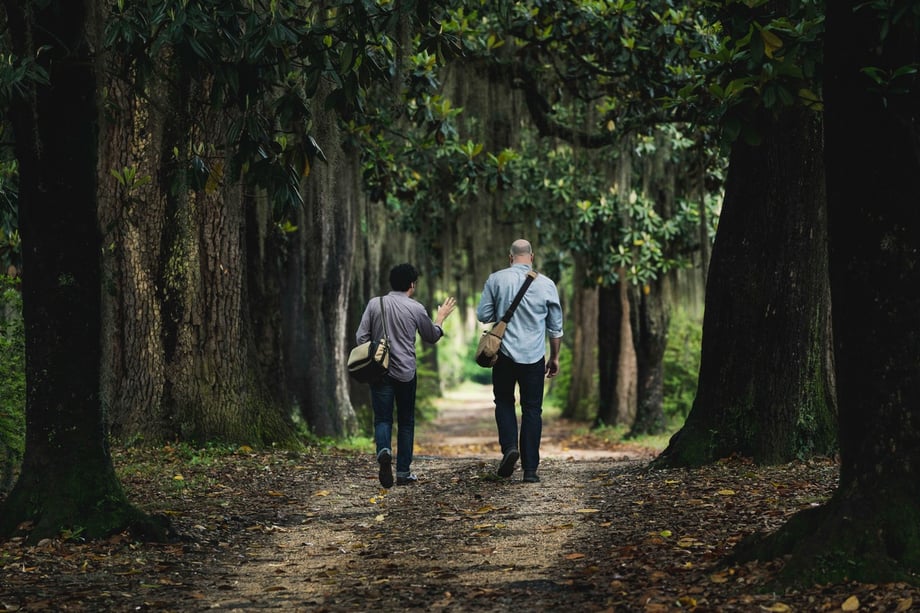 Fernando Decillis' photo of Andrew and Chip walking through a magnolia grove