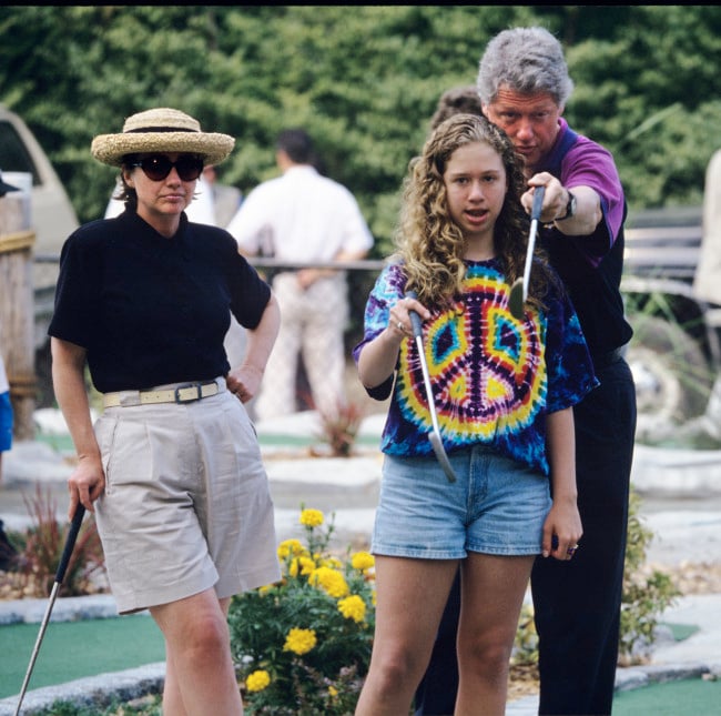 Bill and Hillary Clinton play miniature golf with their daughter, Chelsea, during a Presidential vacation on the Massachusetts island of Martha's Vineyard.