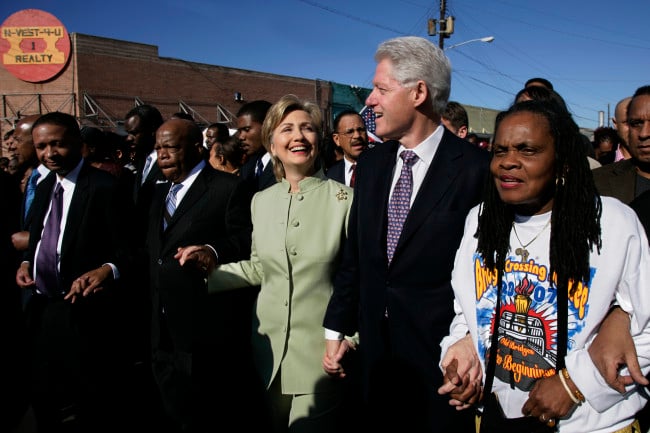 U.S. Senator and presidential candidate Hillary Clinton (D-NY) walks with her husband former U.S. President Bill Clinton during a march commemorating the 1965 Selma-Montgomery Voting Rights March in Selma, Alabama, March 4, 2007. Photo by Brooks Kraft/Corbis