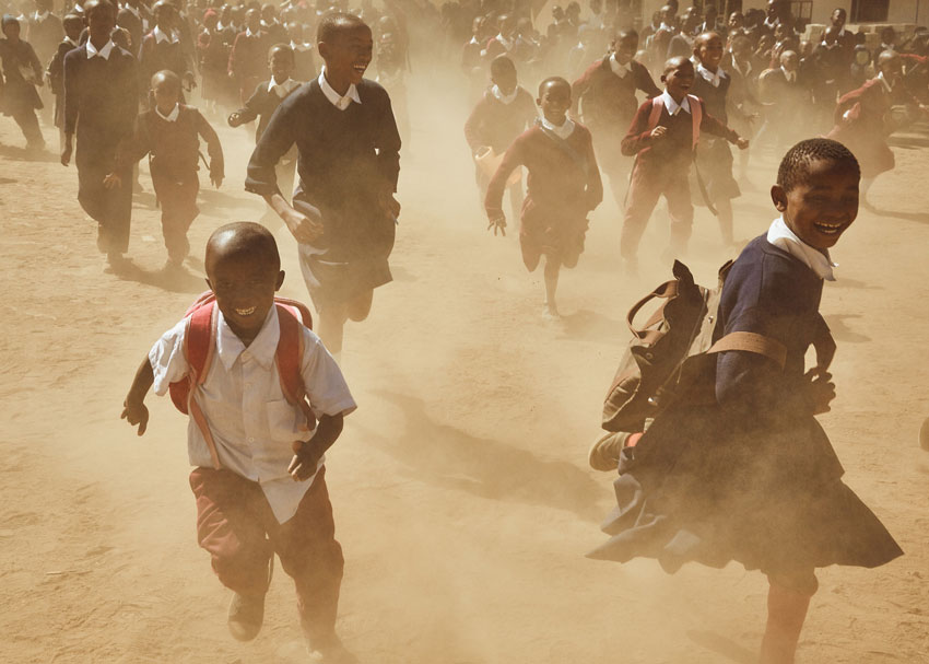 Clay Cook photographs dusted Tanzanian children for Waterboys project.
