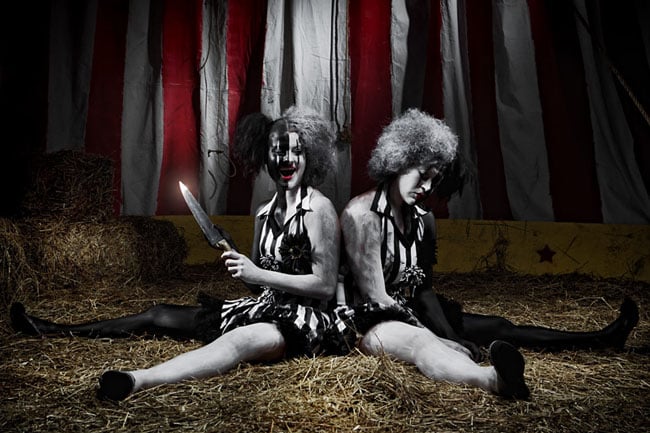 Two clowns, one with a knife; photograph by David E. Jackson