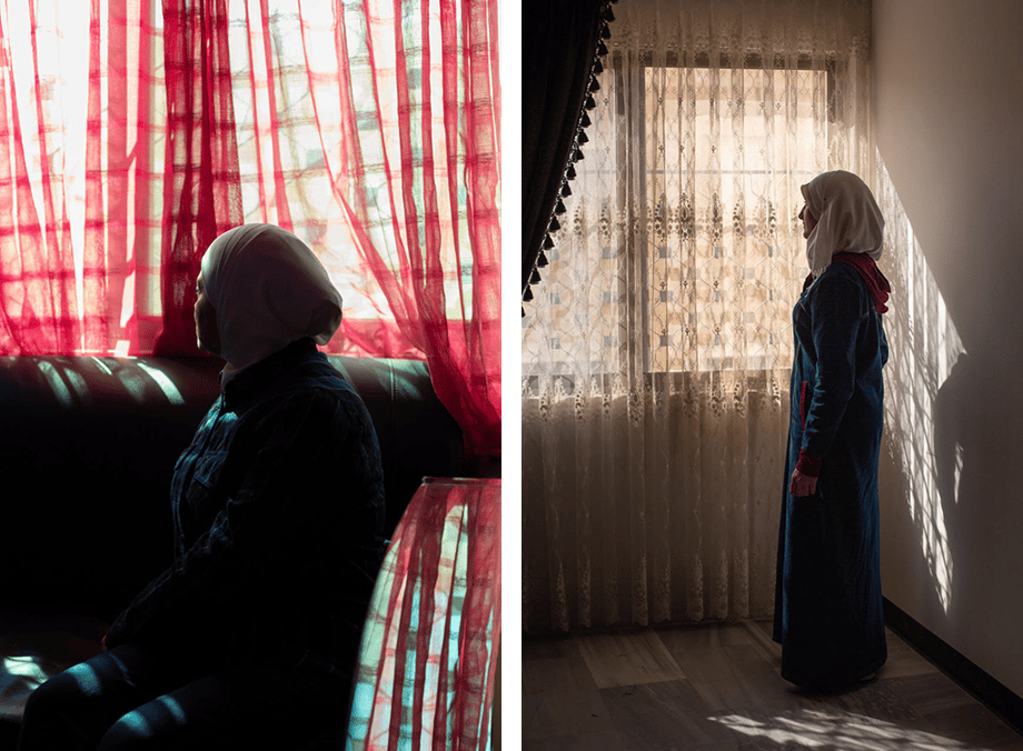 Bradley Secker's photos show Syrian women looking out windows with sheer curtains