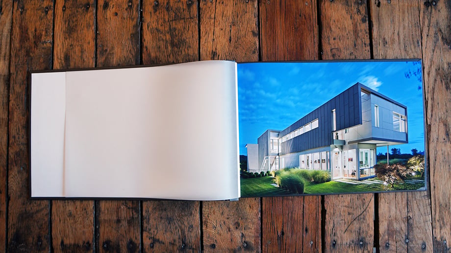 Print portfolio page showing a photo captured by Donna Dotan featuring a  high-end house.