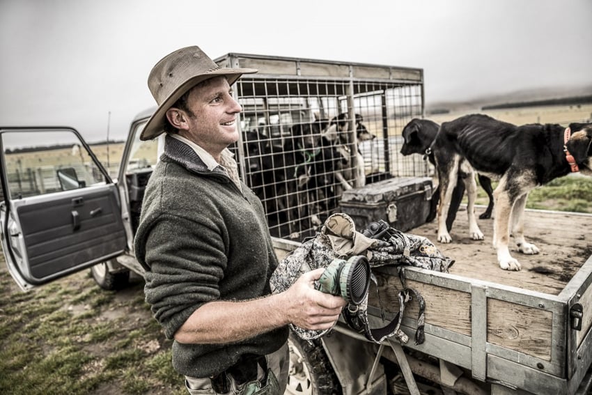 an image of a sheep farmer near his truck by photographer Tadd Myers