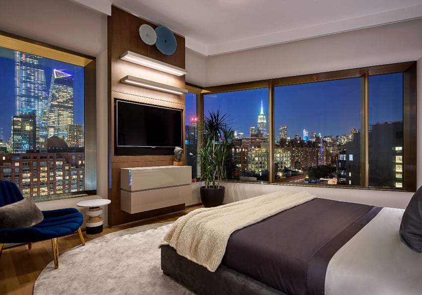 Photo by Barry Grossman of a bedroom overlooking the Manhattan skyline for Pepe Calderin NYC.