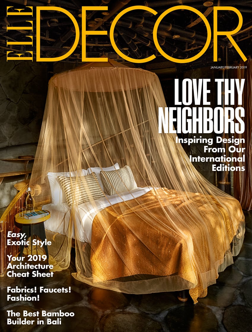 Martin Westlake's cover shot for Elle Decor shows a canopy bed draped in orange silk 