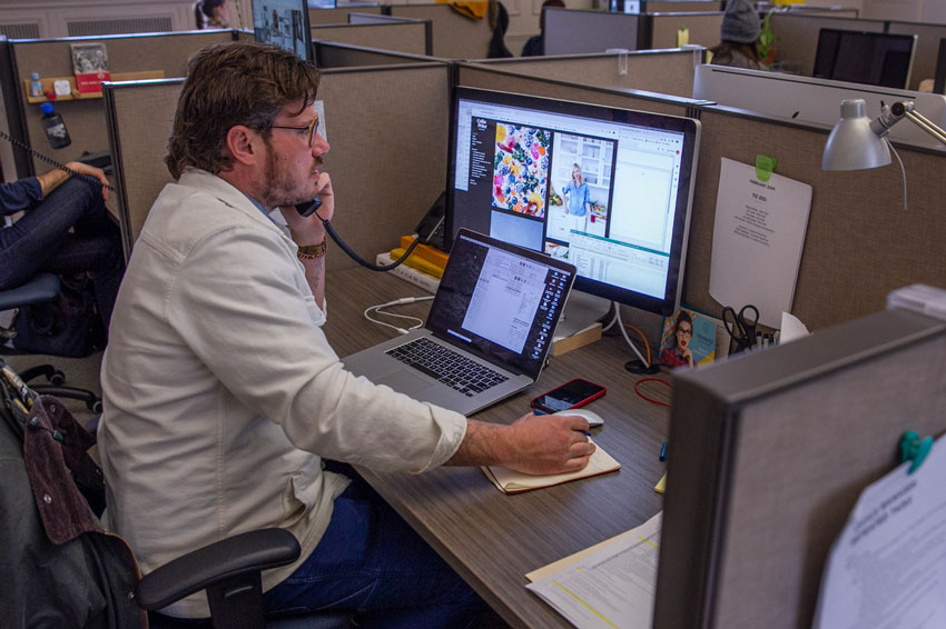 Photo of Bryan Sheffield at his desk at Wonderful Machine networking.