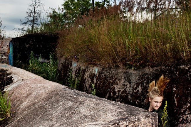 Aki-Pekka Sinikoski photographs of someone with mohawk in a trench