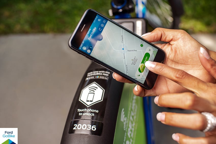 jayms ramirez photographs a ford gobikes user checking a mobile phone map of silicon valley
