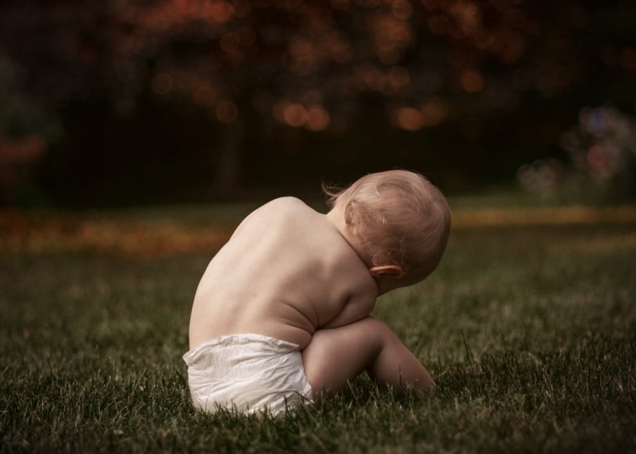A baby in the grass, photograph by Rachel Hulin