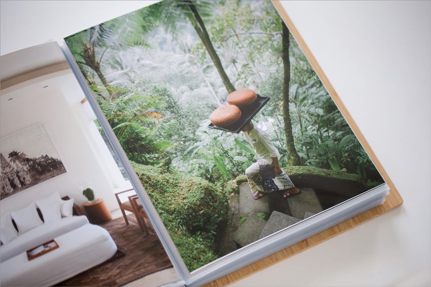 Lauryn's final updated print portfolio opened to a photo of a person walking through a forest.