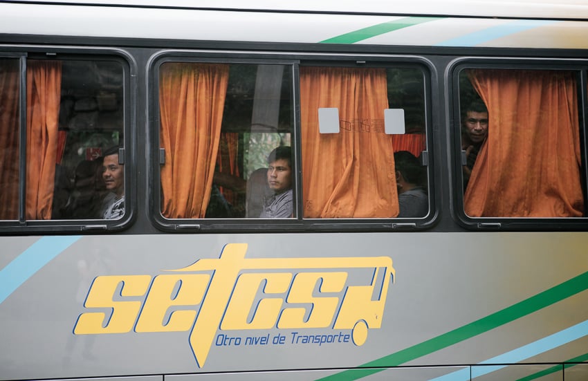 Photo of migrants on a bus published on The Intercept taken as part of an IWMF Adelante reporting fellowship by Alicia Vera.