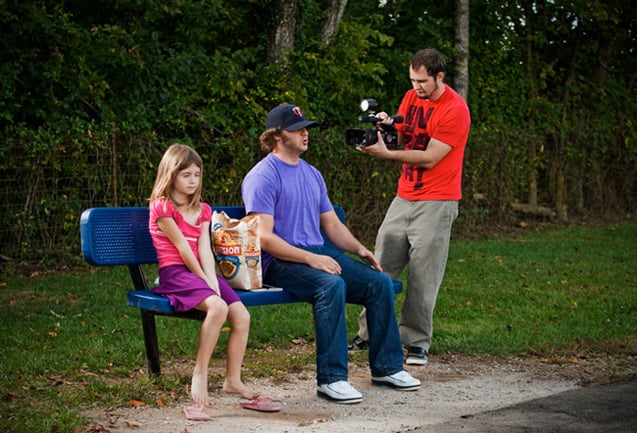 Photo of a man and girl on a bench by Los Angeles-based portrait photographer Jesse Rieser. 
