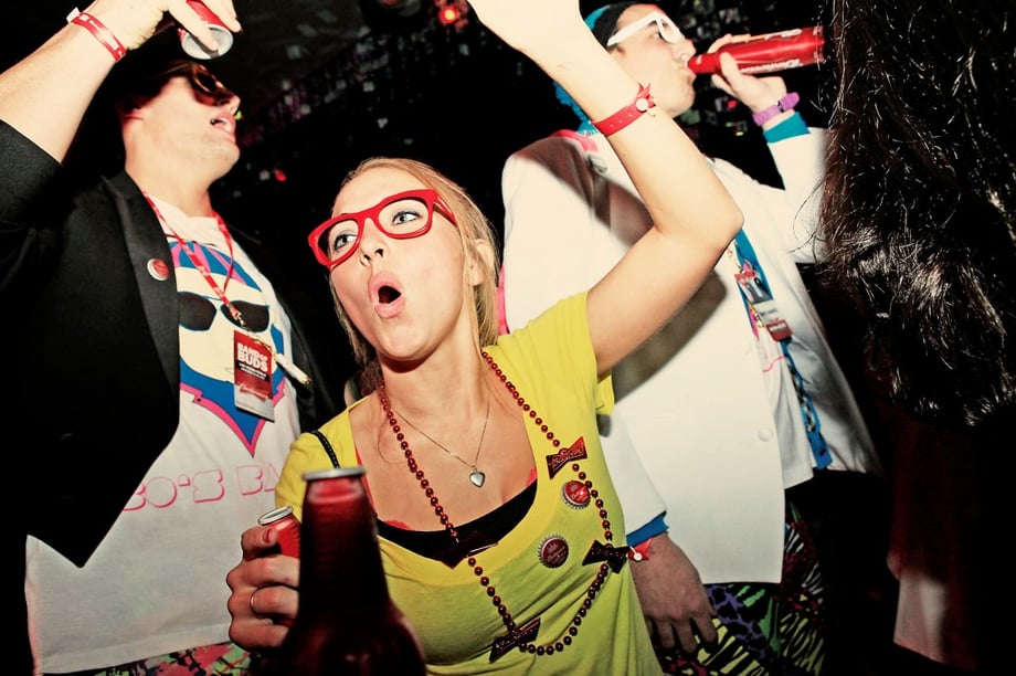 Woman partying with Budweiser photographed by Drew Reynolds