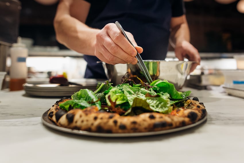 Photo of a brick oven pizza for Life & Thyme.