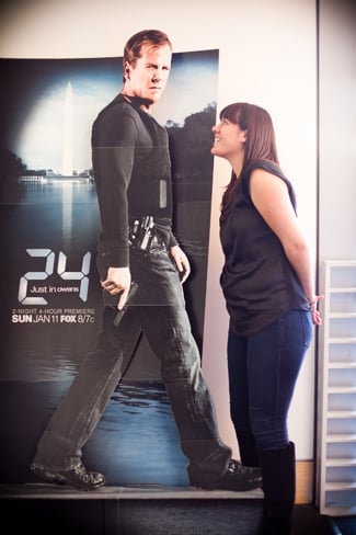 Maria posing with poster of Kiefer Sutherland in 24 as Jack Bauer