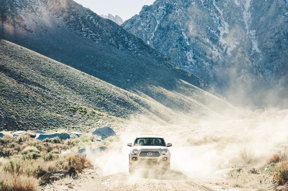 Toyota 4Runner driving on a dirt road, photo by Mark Skovorodko