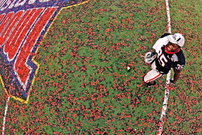 Football player shot by Atlanta-based conceptual photographer Pouya Dianat