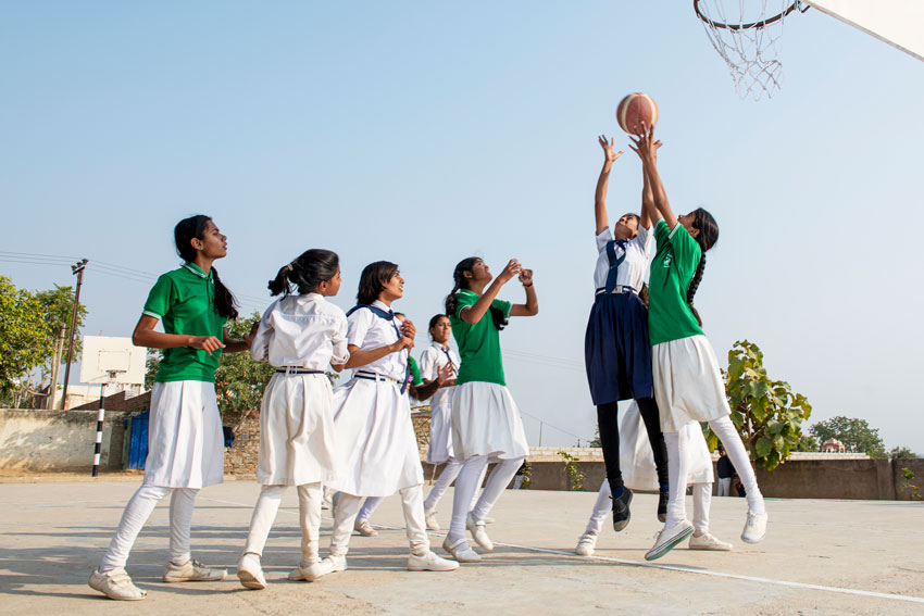 Girls at a Ninash Foundation school playing basketball.